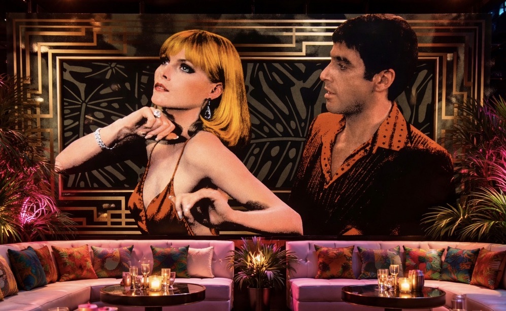 Tony Montana and Elvira mural in an Art Deco lounge